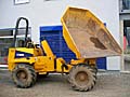 Auf dem Bild ist ein gelber Raddumper abgebildet.